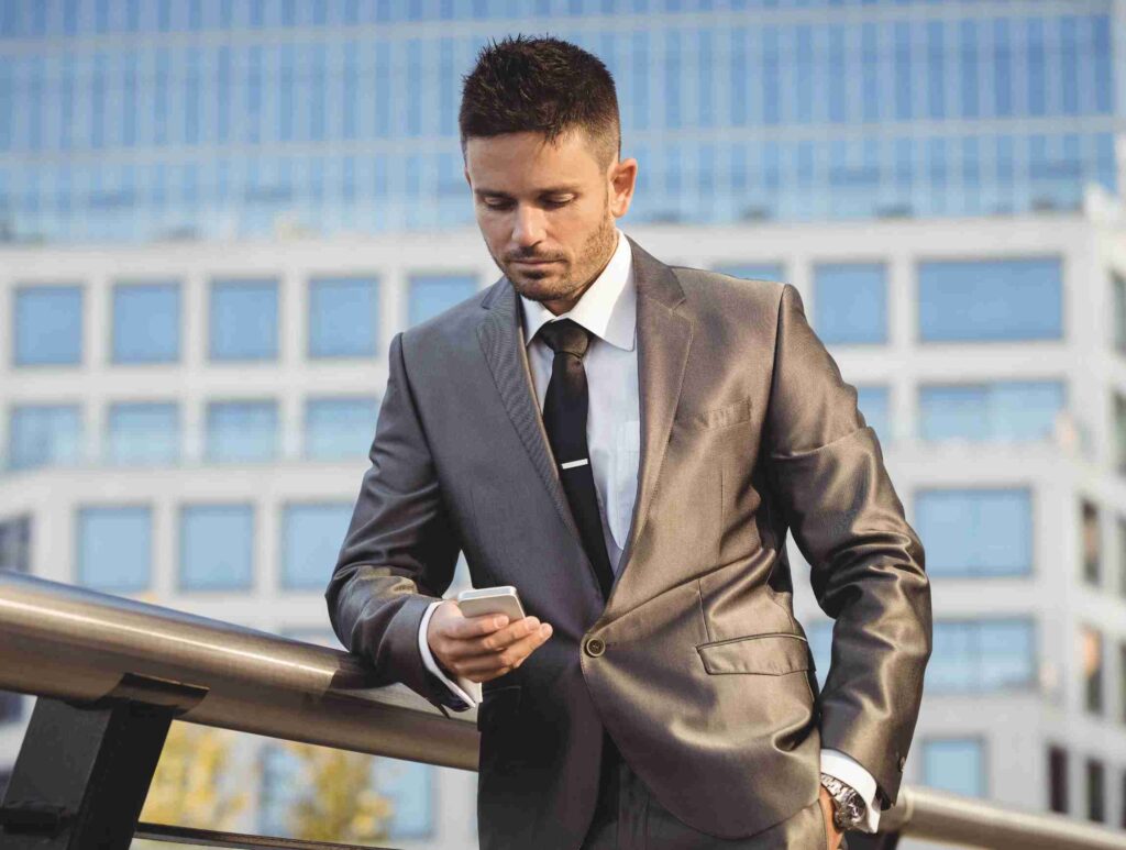 A silhouette of a woman walking confidently while holding a briefcase.