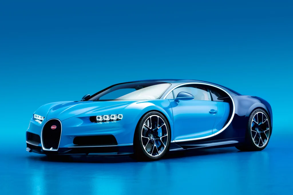 A blue Bugatti Chiron sports car against a matching blue background.