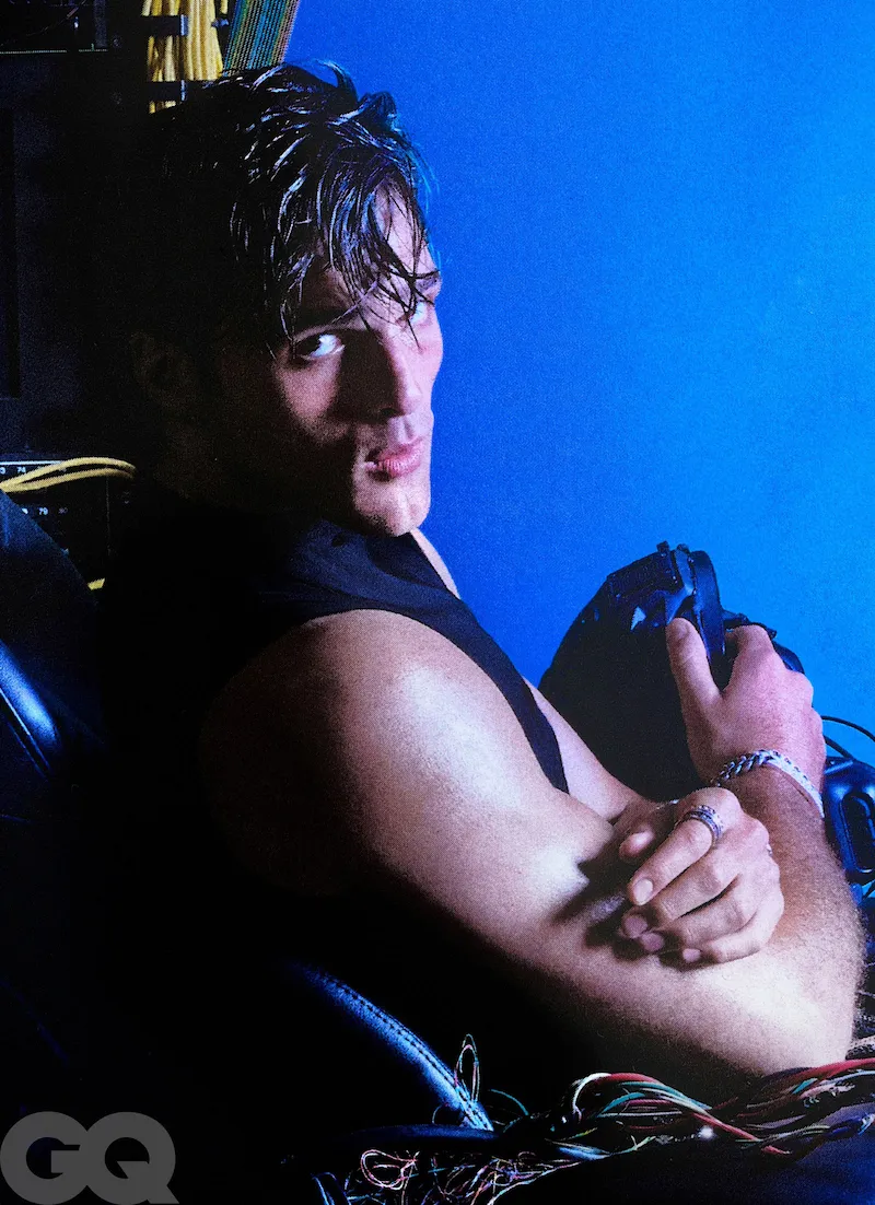 An elegant dining room with white tablecloths, red chairs, chandeliers, large windows, and ornate decor.