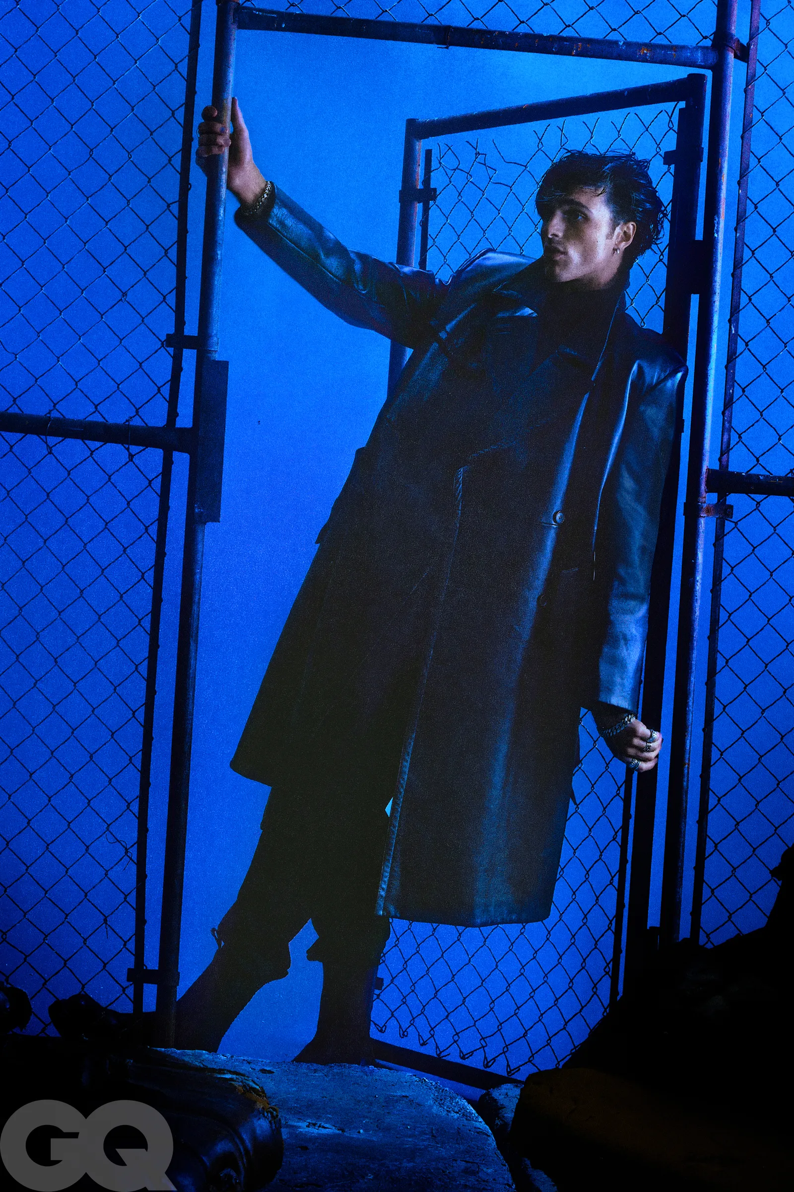 An elegant dining room with white tablecloths, red chairs, chandeliers, large windows, and ornate decor.