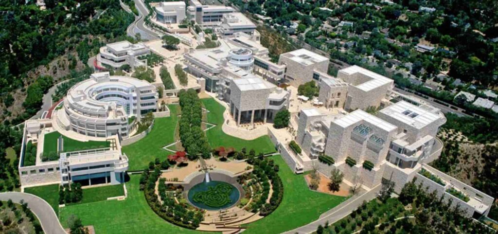 An aerial view of a modern campus with multiple buildings and green spaces.