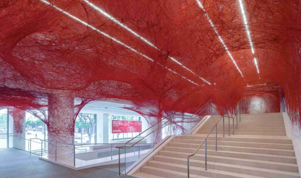 An aerial view of a modern campus with multiple buildings and green spaces.