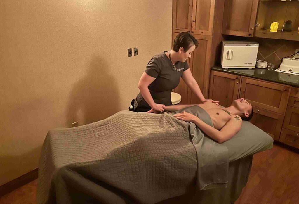 A modern boutique interior with curved display shelves, assorted products, and a large promotional image of a woman's face.