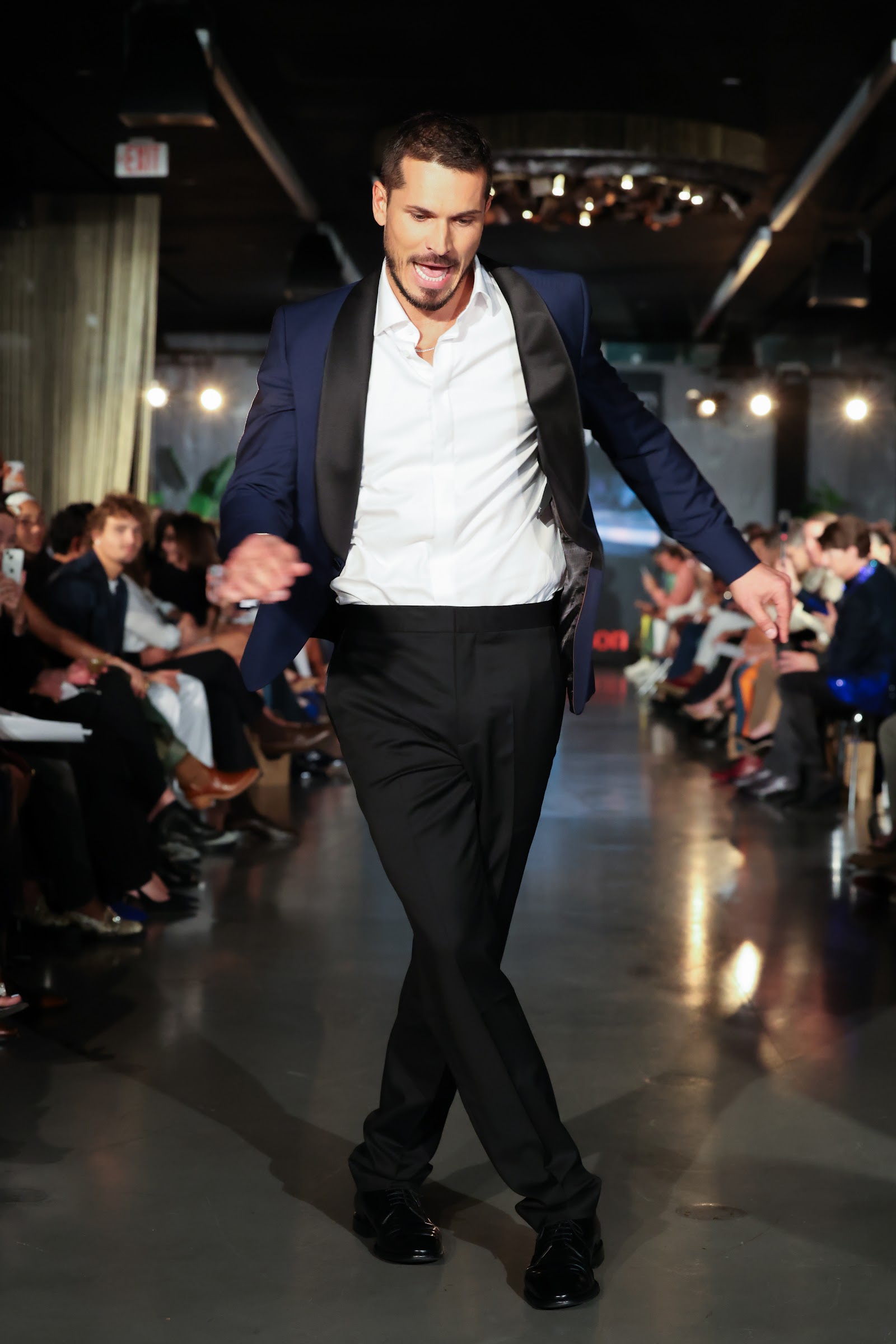 Gleb Savchenko dancing down the runway at the Blue Jacket Fashion Show