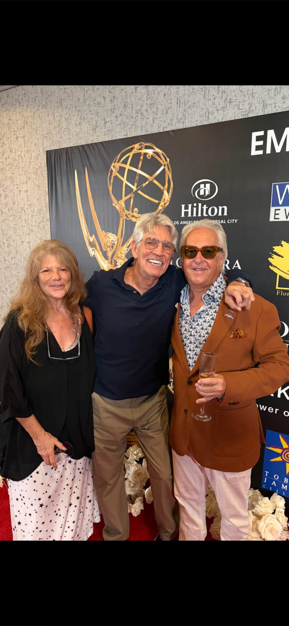 Three guests posing together at the 2026 Emmy lifestyle gifting suite