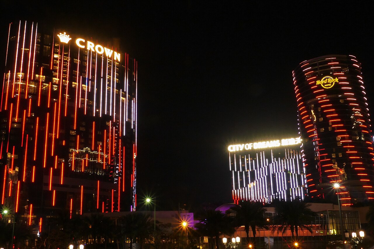 City of Dreams Macau illuminated at night on the Cotai Strip, where REM joins Morpheus and NÜWA