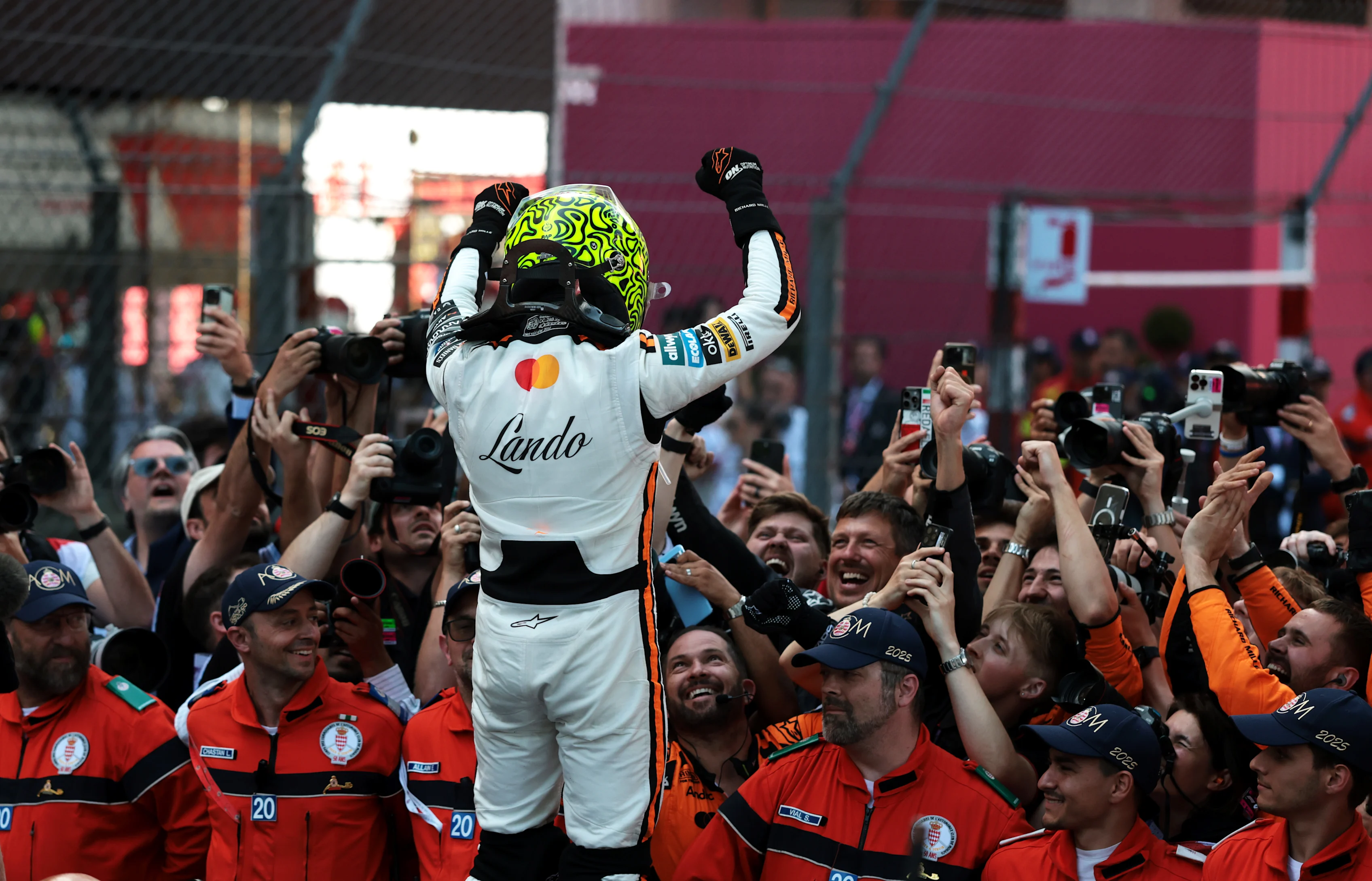 Race winner Lando Norris celebrates on the podium at the 2025 Monaco Grand Prix