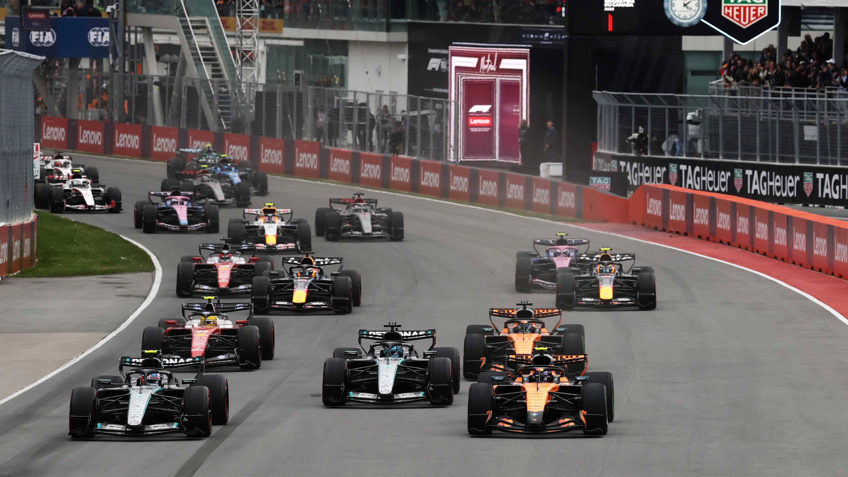 Mercedes and McLaren cars battle at close quarters during the Canadian Grand Prix at the Circuit Gilles-Villeneuve in Montreal.