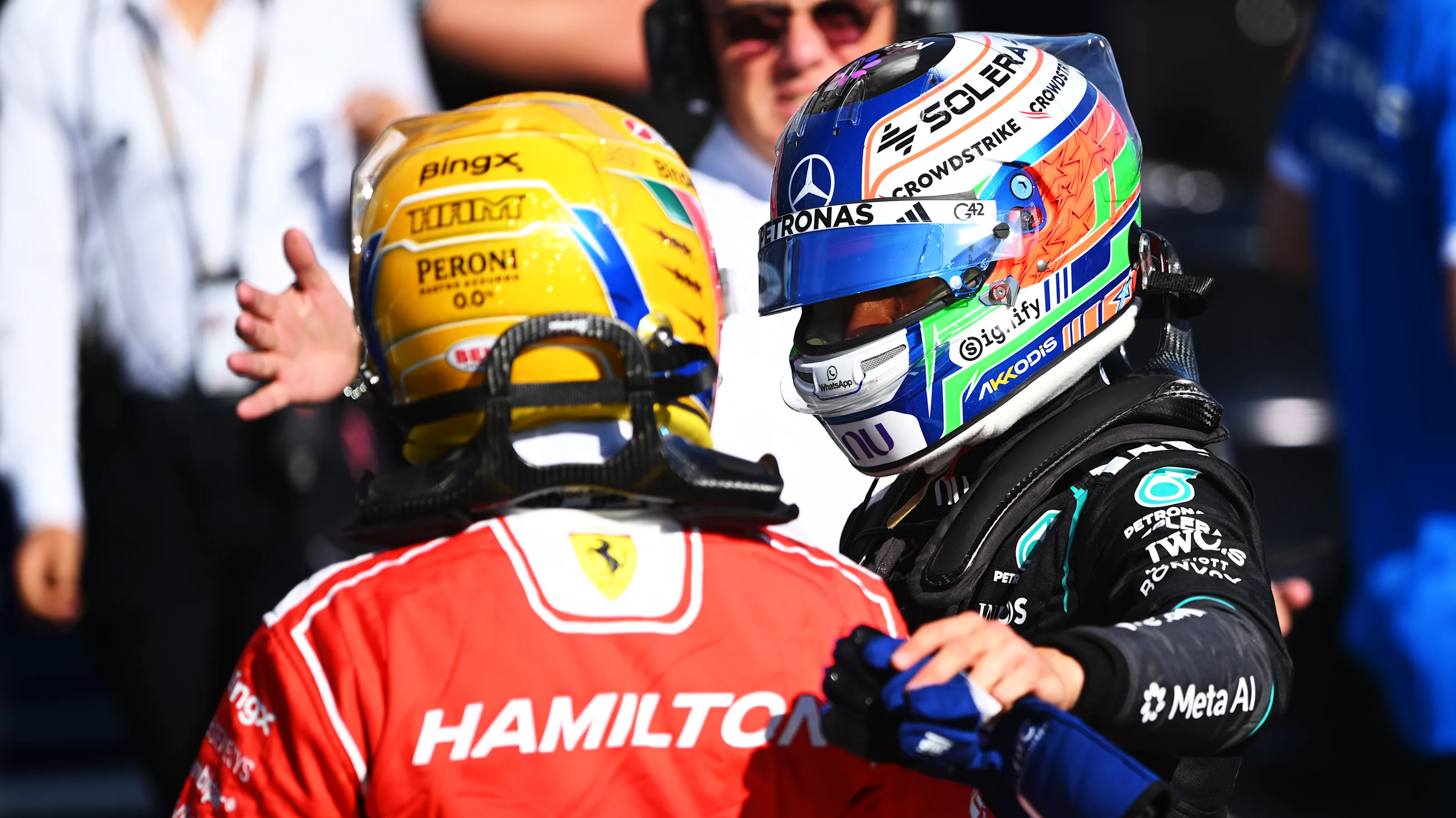 Lewis Hamilton of Scuderia Ferrari and Kimi Antonelli of Mercedes in parc ferme at Silverstone.