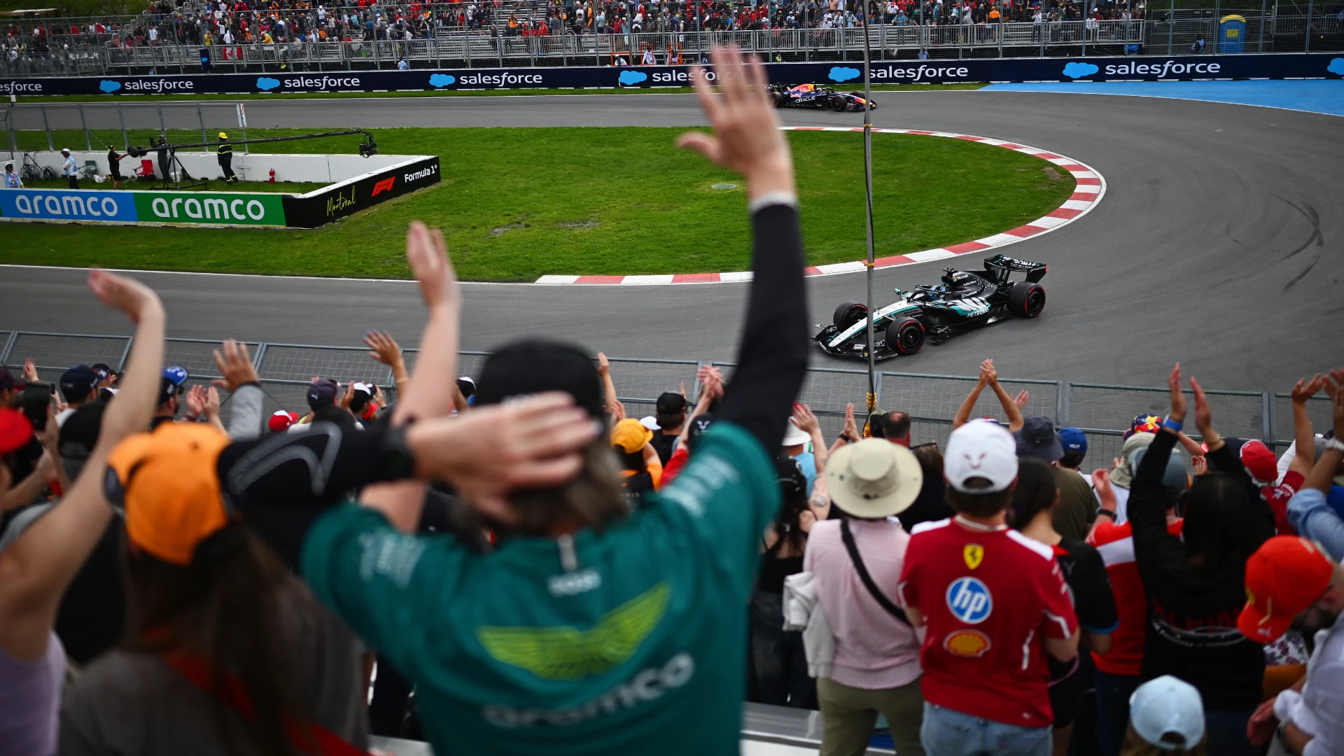 George Russell's Mercedes runs at the Circuit Gilles-Villeneuve in Montreal as fans cheer from the grandstands during the 2026 Canadian Grand Prix weekend.