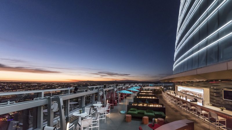 Spire 73 rooftop bar at night with downtown Los Angeles skyline views