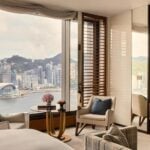 Grand Harbour View Room at Rosewood Hong Kong, a king room with a freestanding soaking tub, marble bathroom and a Victoria Harbour view