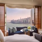Harbour View Room at Rosewood Hong Kong with floor-to-ceiling windows overlooking Victoria Harbour