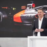 Audi CEO Gernot Döllner speaking at a podium