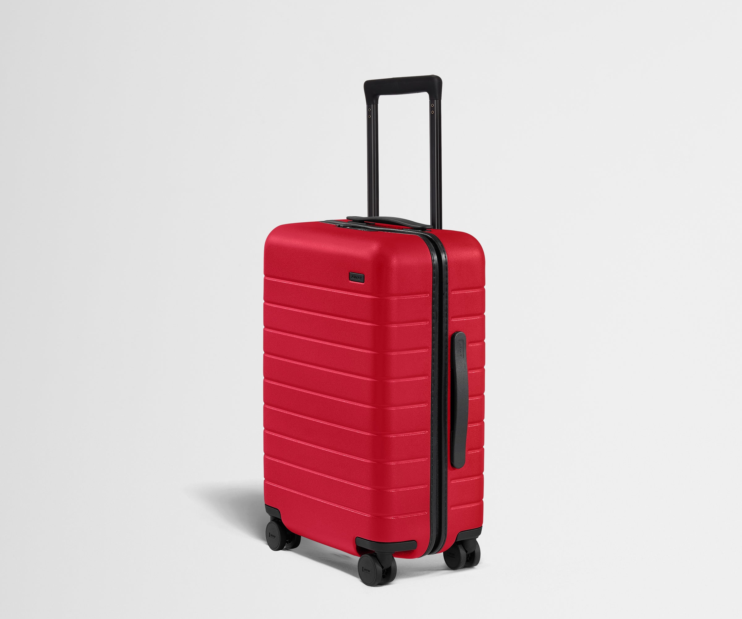 Away Carry-On hard-shell suitcase in cherry red
