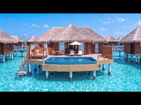 Baros Maldives overwater villas and house reef, featured in a 4K island tour