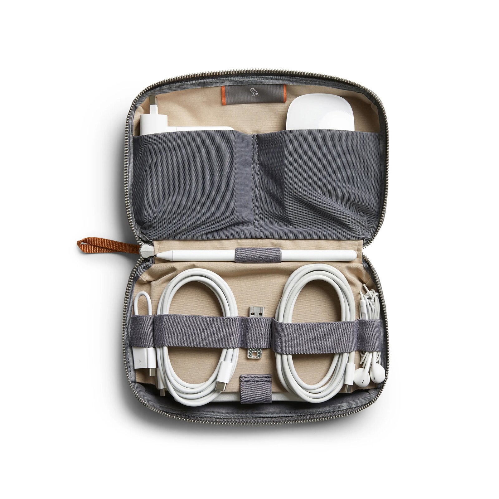 Bellroy Tech Kit organizer laid flat with cables and chargers