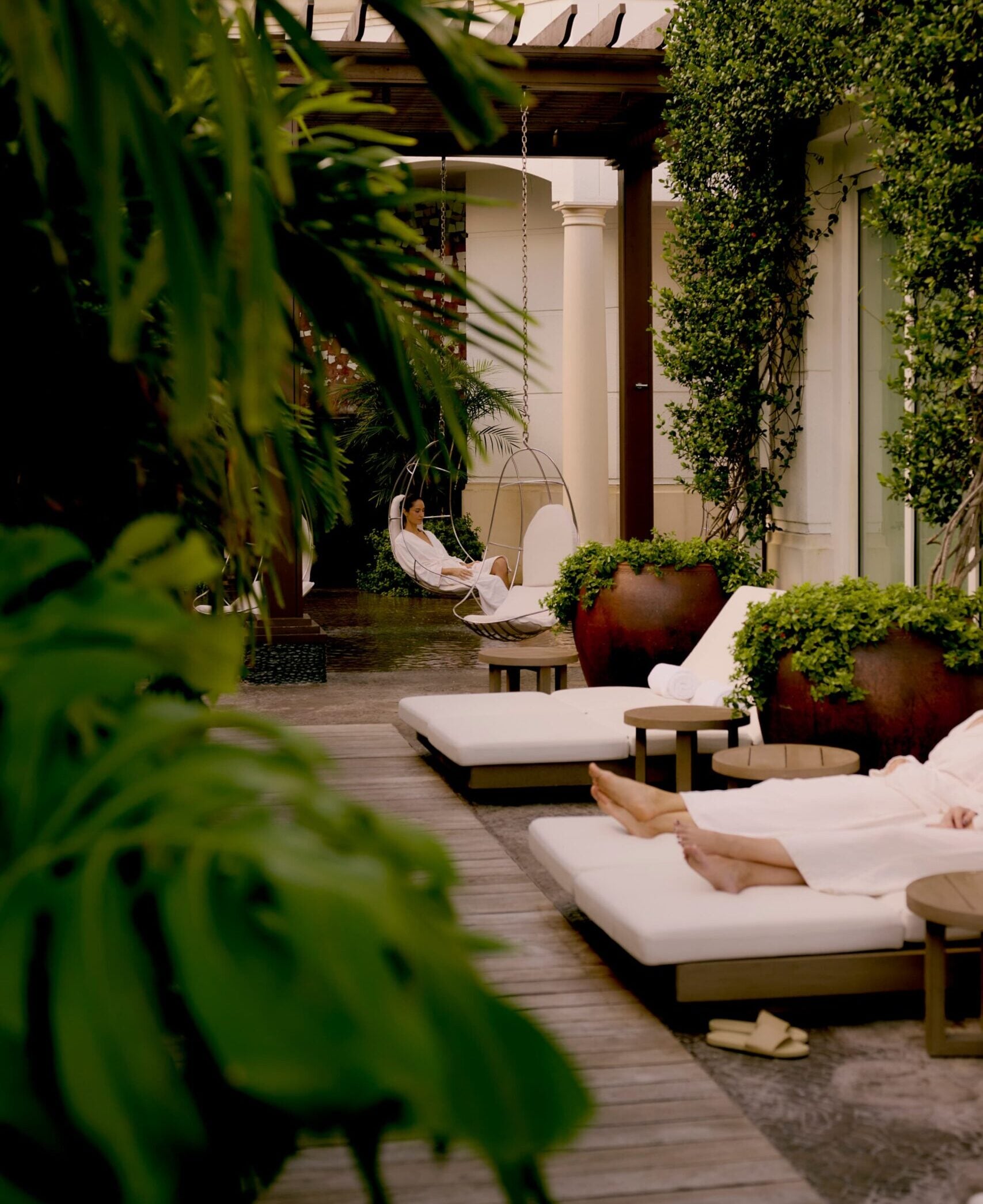 Loungers and swing chairs in the Self-Centered Garden at Eau Spa, Eau Palm Beach Resort and Spa
