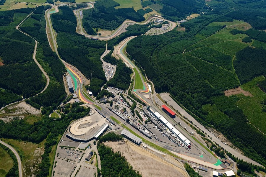 An aerial view of the Circuit de Spa-Francorchamps winding through the forests of the Ardennes.