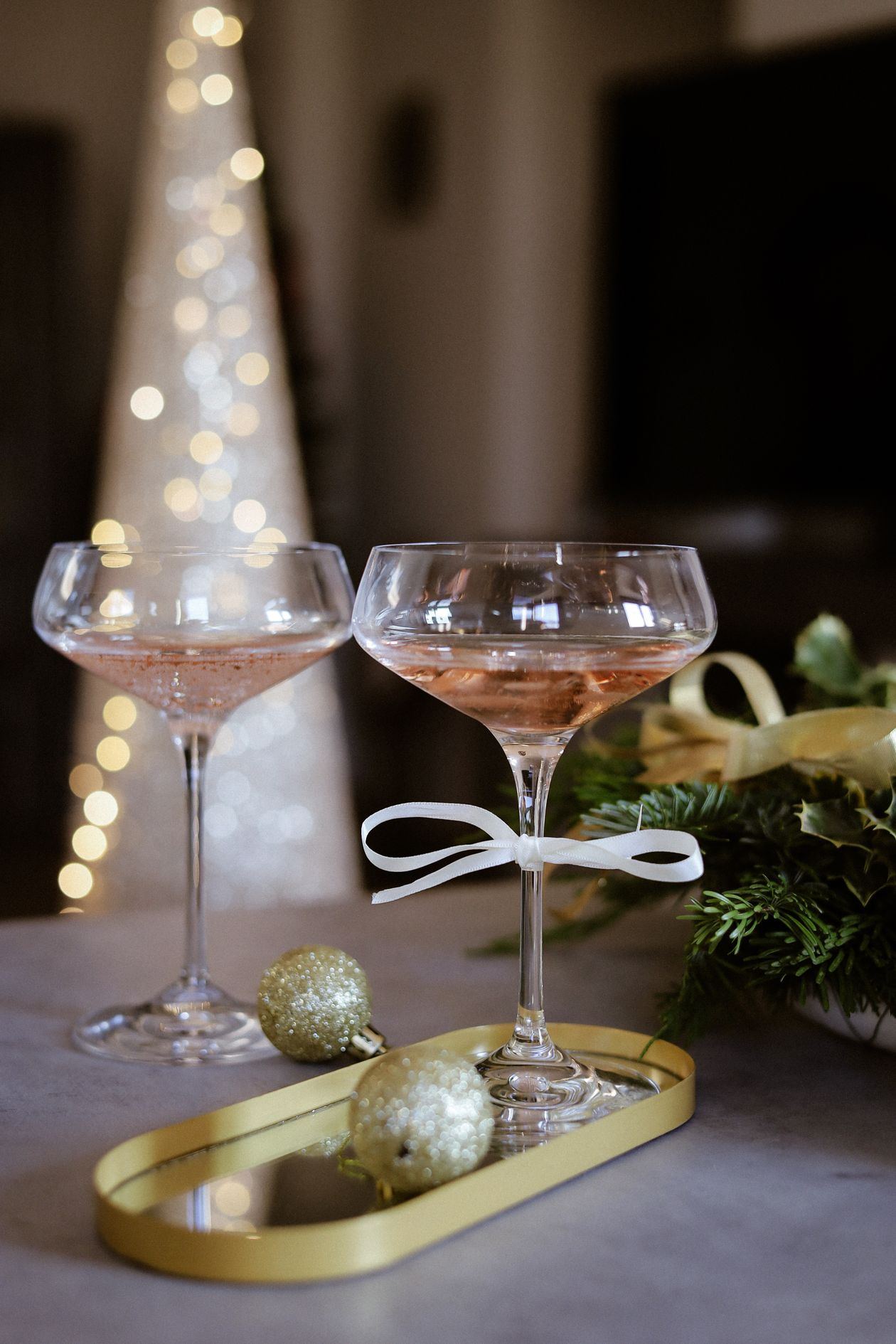 Champagne glasses with elegant gold decor ready for a festive toast at an upscale Los Angeles celebration