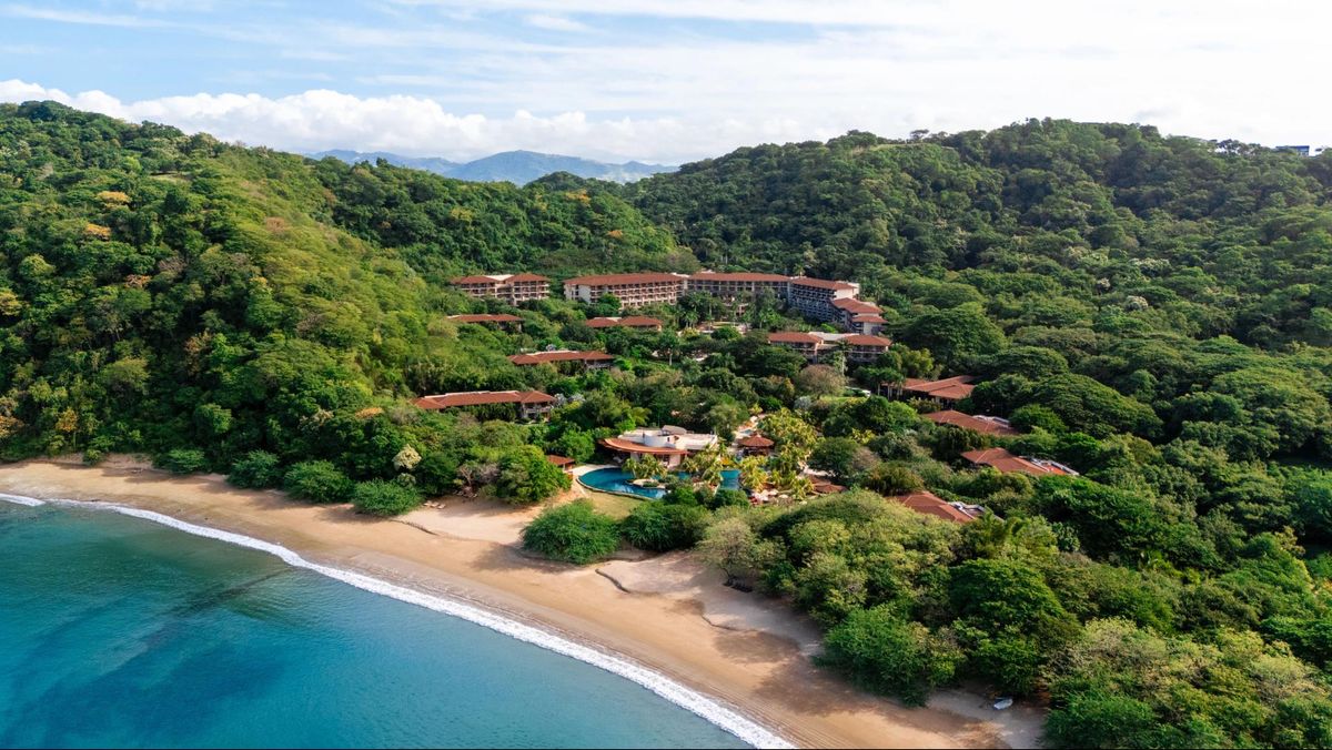 JW Marriott Costa Elena resort buildings set among tropical hills above the beach in Guanacaste, Costa Rica
