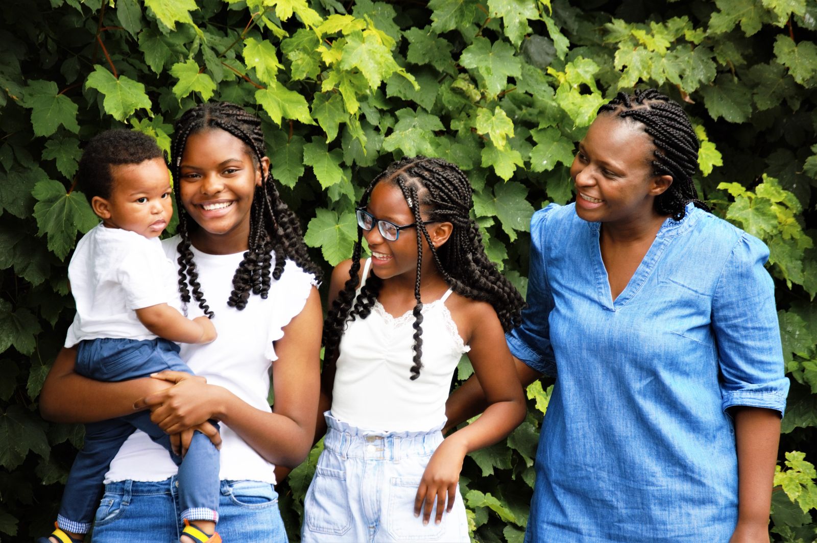 Joyful family laughing together outdoors during a holiday portrait session in Los Angeles