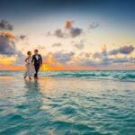 Couple on a beach at sunset during a Los Angeles elopement