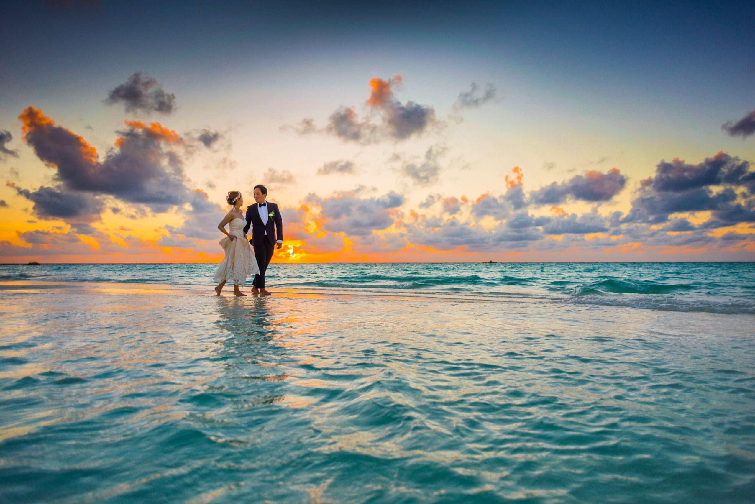 Couple on a beach at sunset during a Los Angeles elopement
