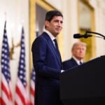 Federal Reserve Chair Kevin Warsh speaking at a lectern