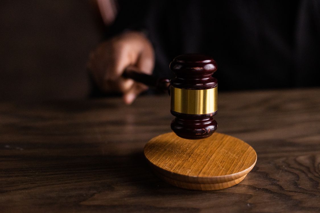Gavel on a sounding block, symbolizing the federal court's fair use ruling against AI training on copyrighted work