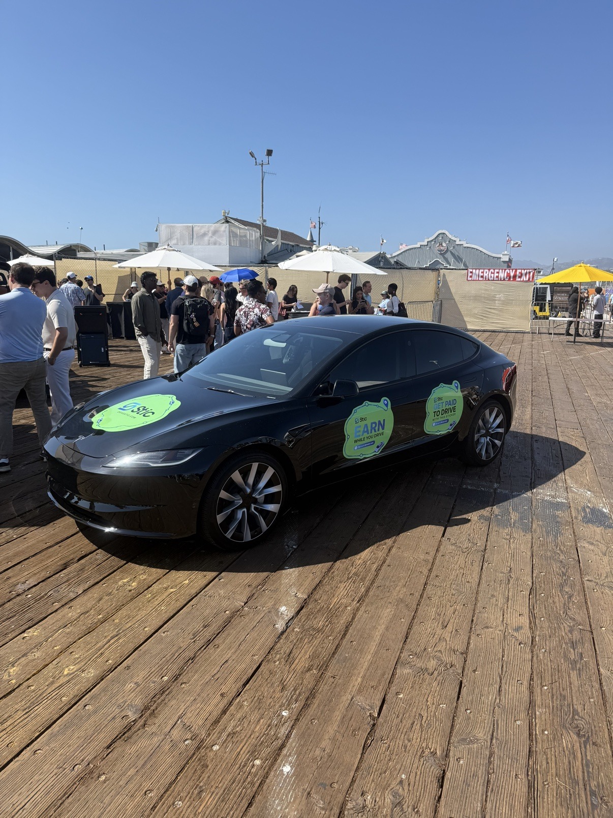 Tesla wrapped with Stic car advertising at Hawkefest 2026, Santa Monica Pier