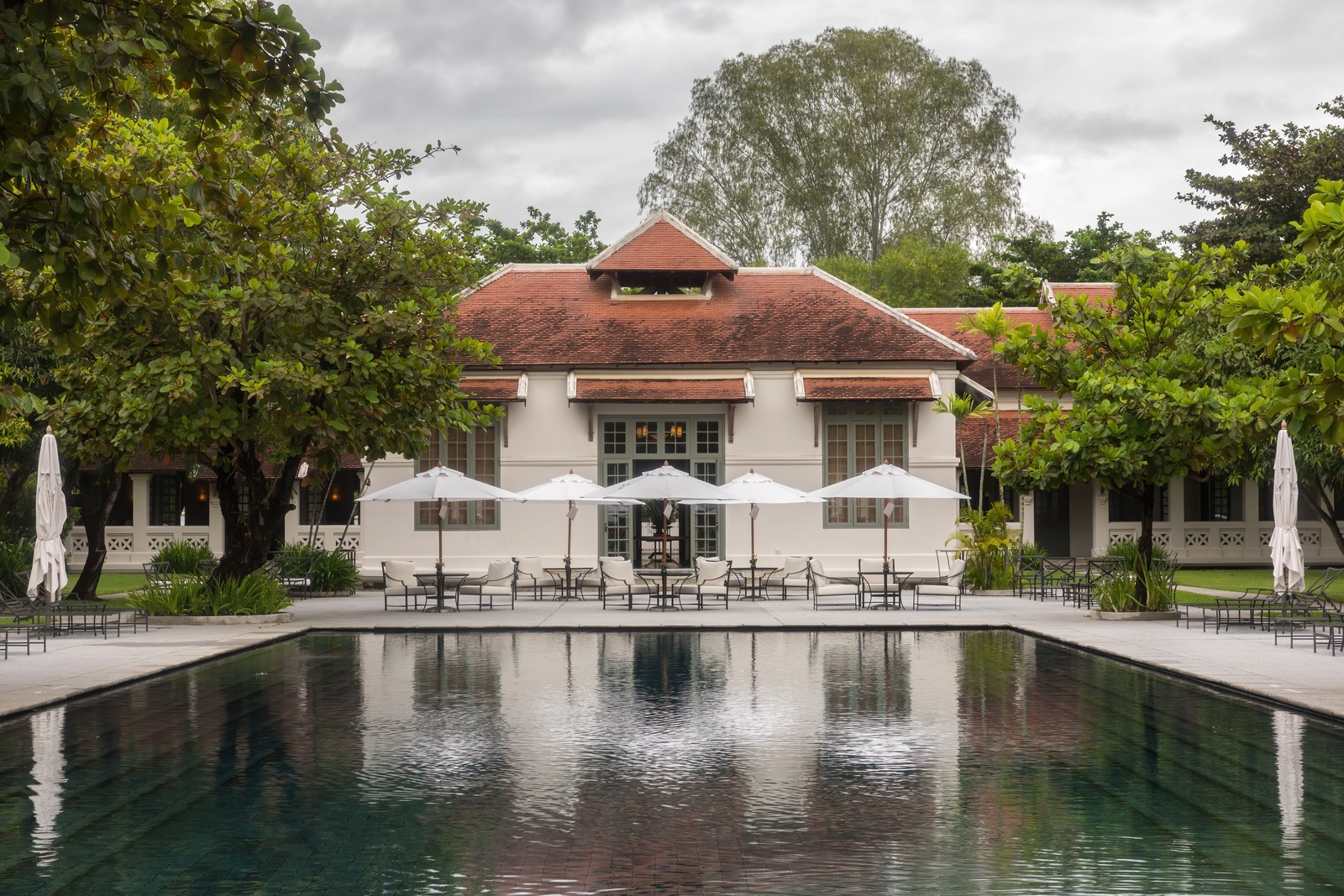 Luxury resort swimming pool and terrace with loungers