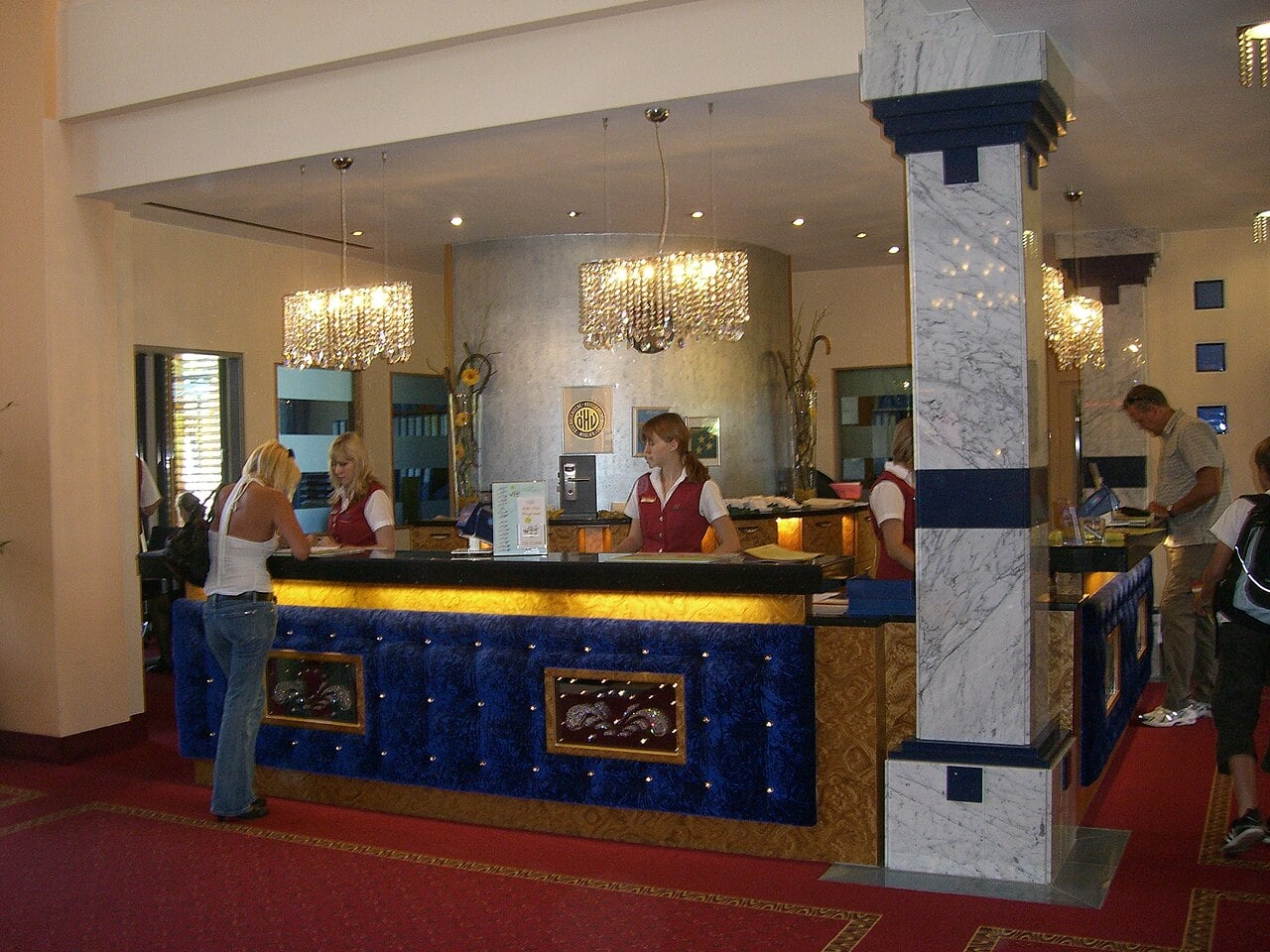 Hotel reception desk lobby where guests check in and request room upgrades