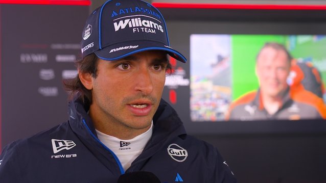 Carlos Sainz in Williams team colors during a media interview, from an official Formula1.com video still.