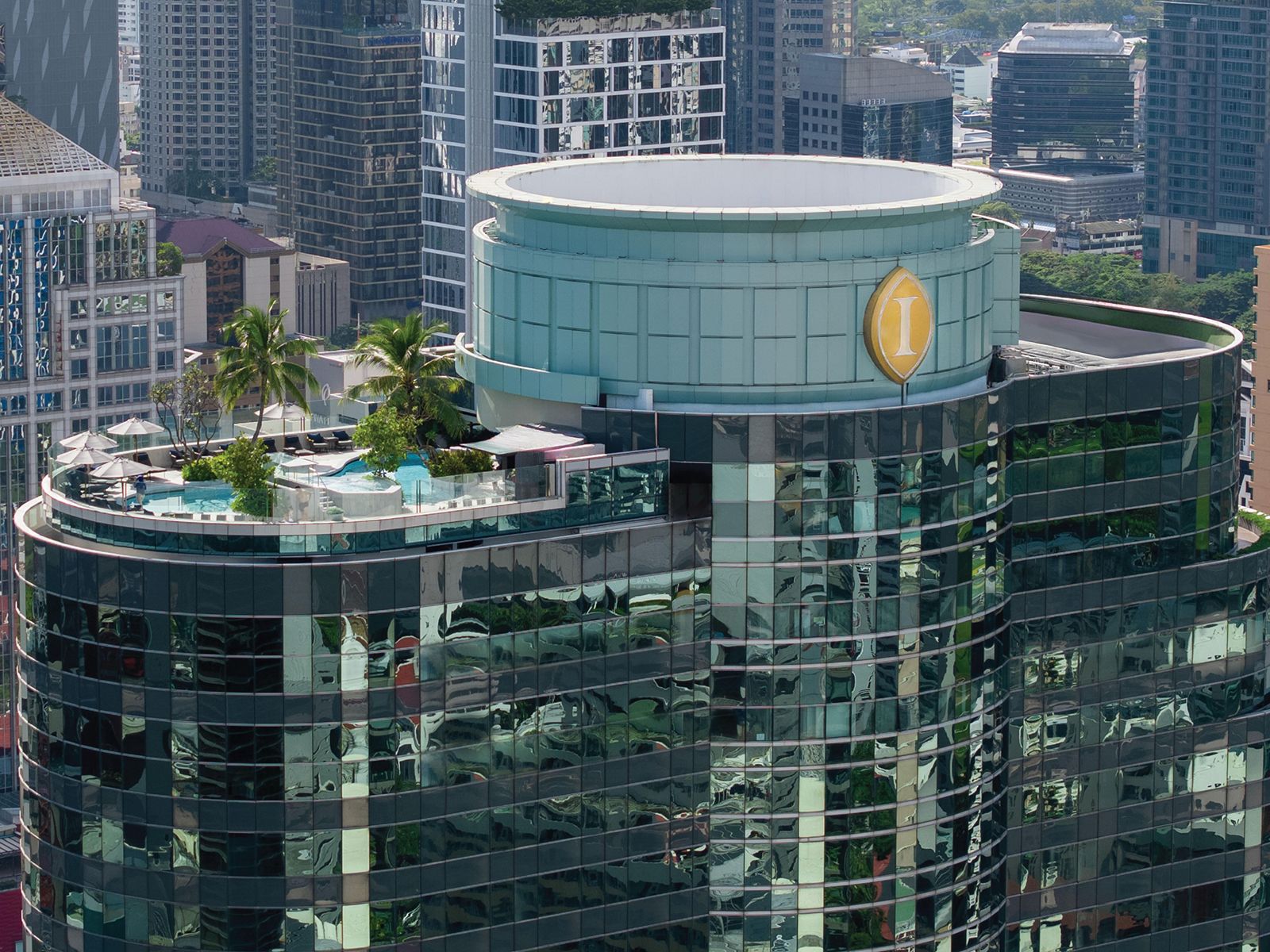 InterContinental Bangkok's curved glass tower with rooftop pool deck, the brand's Bangkok flagship