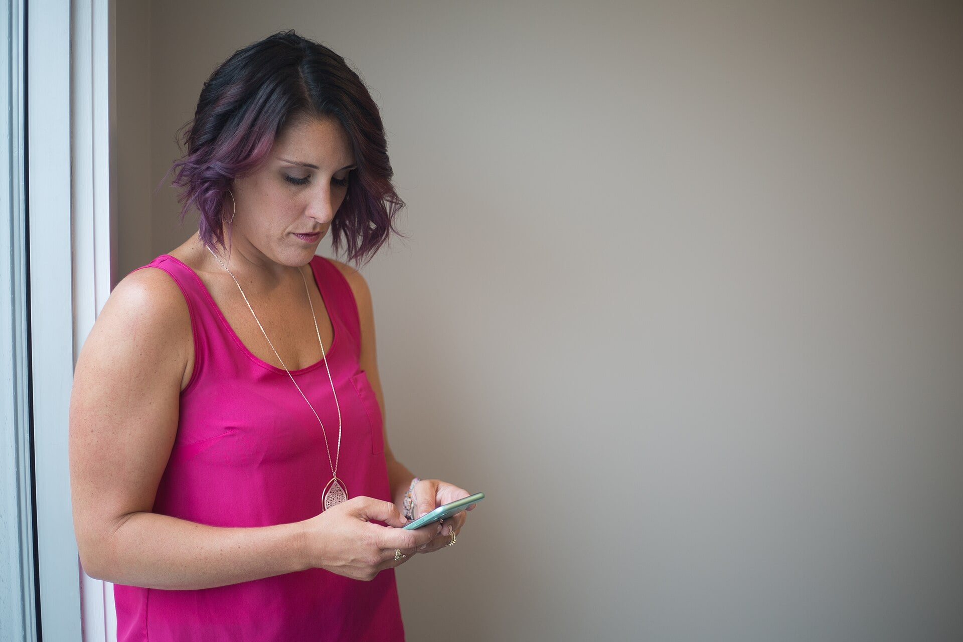 A woman texting on her smartphone