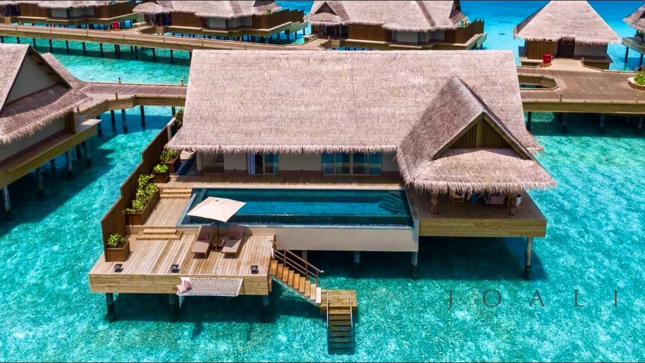 JOALI Maldives Luxury Water Villa with Pool over turquoise lagoon at sunset, from the 4K POV tour video.