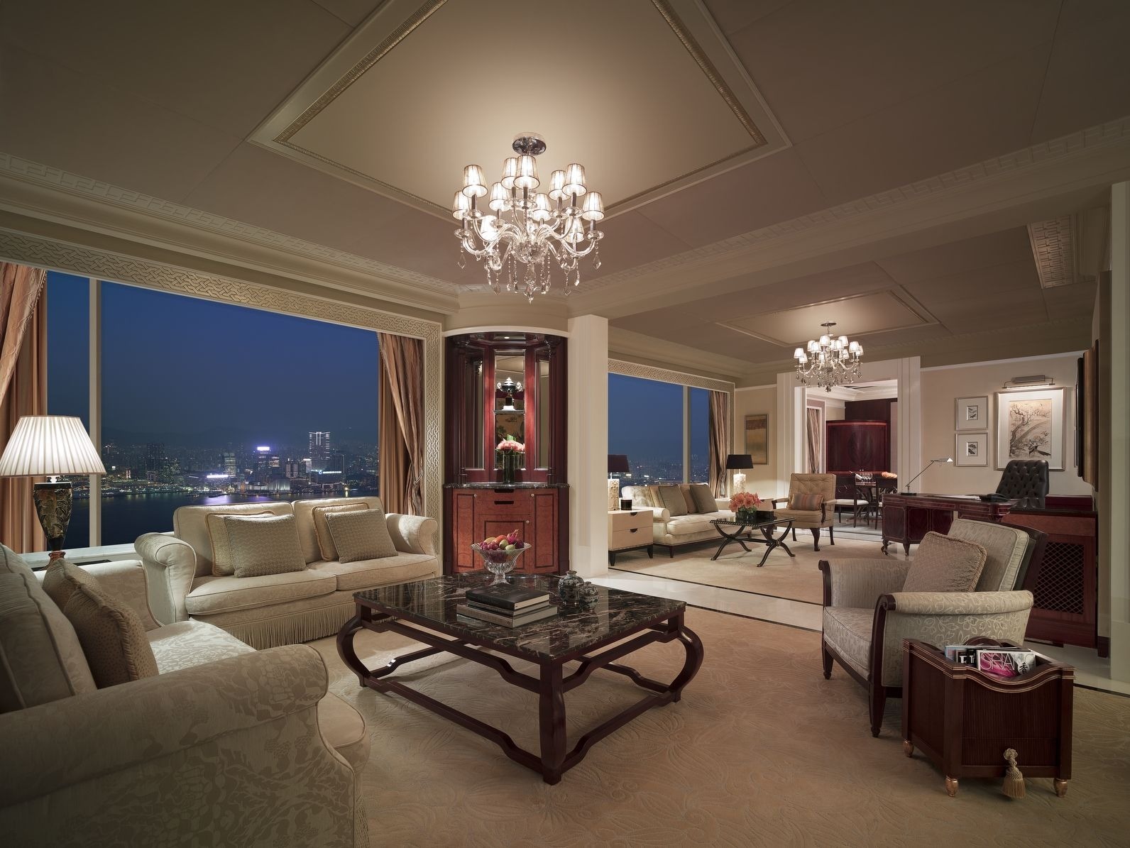 Luxurious hotel suite bedroom with plush bedding and soft lighting