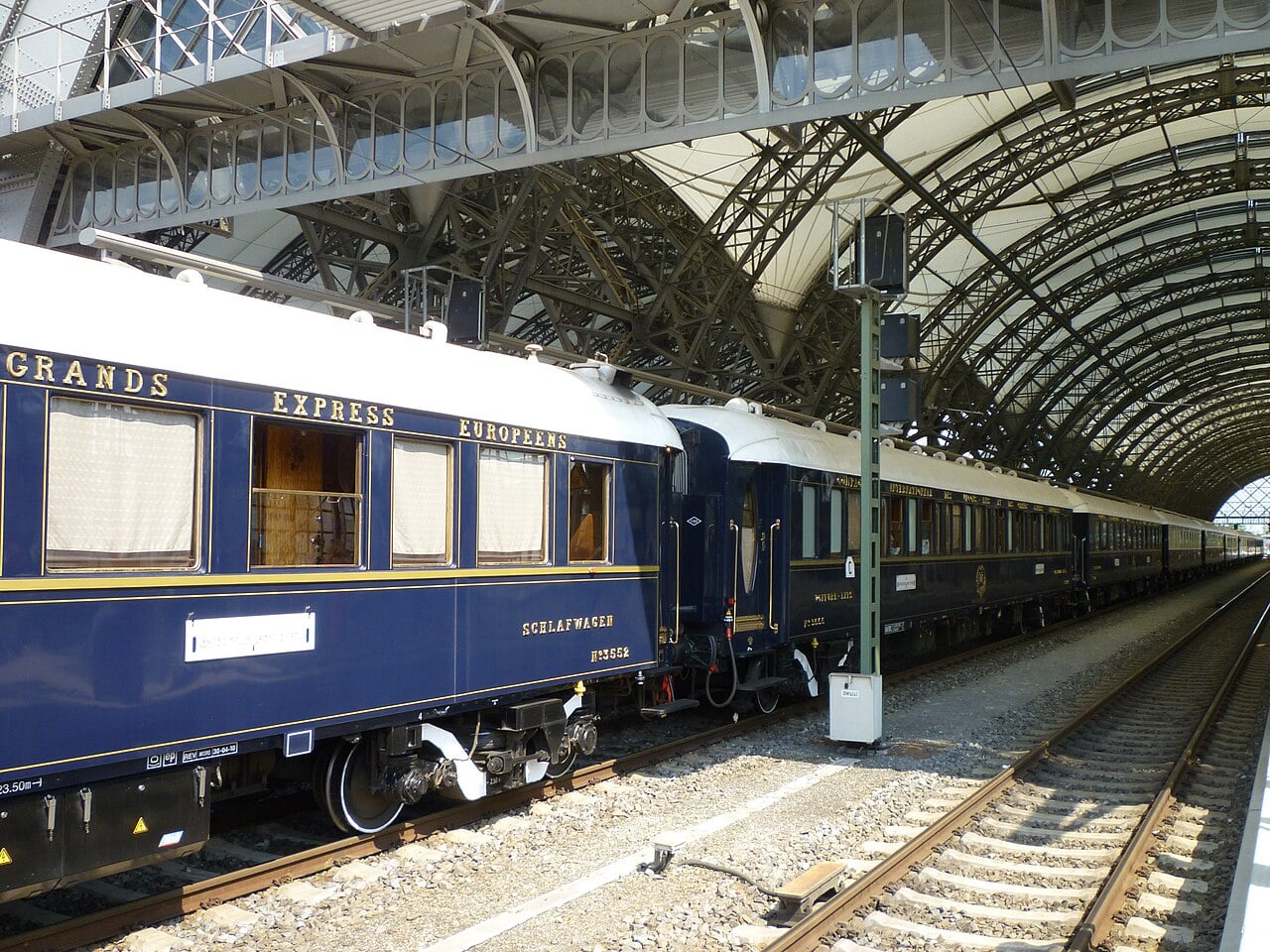 The Venice Simplon-Orient-Express in classic navy livery at a grand station