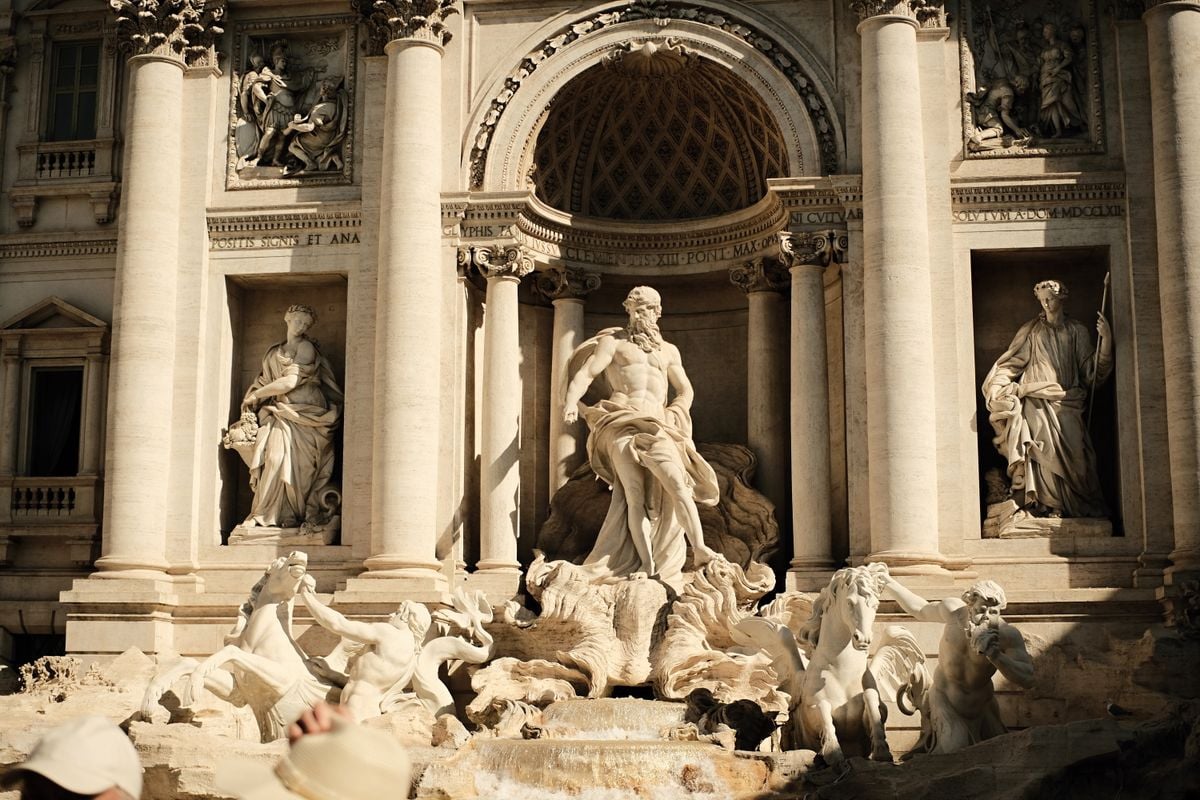 Detailed view of the Trevi Fountain in Rome, showing its Baroque sculptures and stone facade