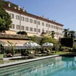 Passalacqua villa facade above its terraced gardens and lake-view pool at Moltrasio, Lake Como