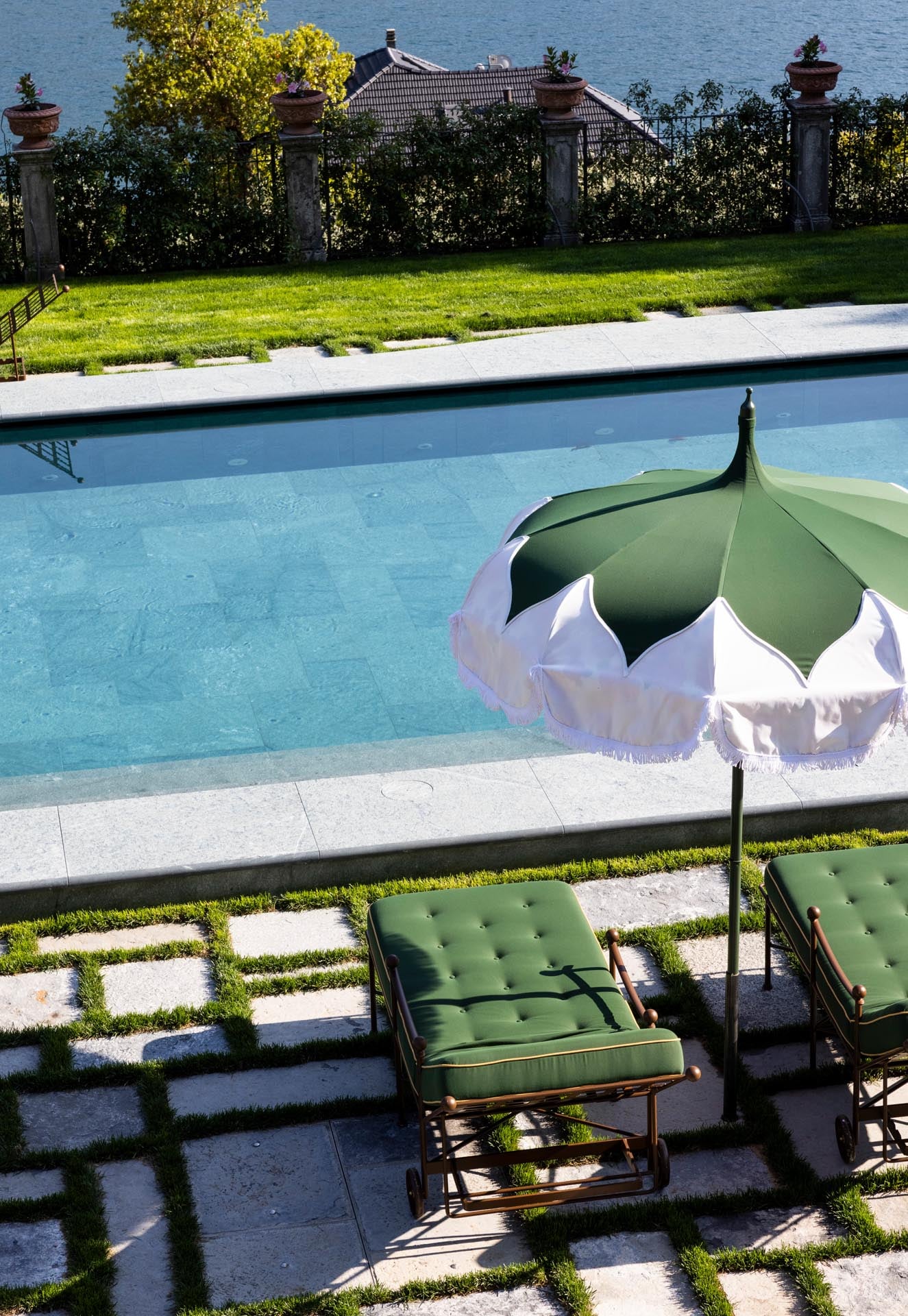 Lake-view pool terrace at Passalacqua with JJ Martin for La DoubleJ parasols above Moltrasio, Lake Como
