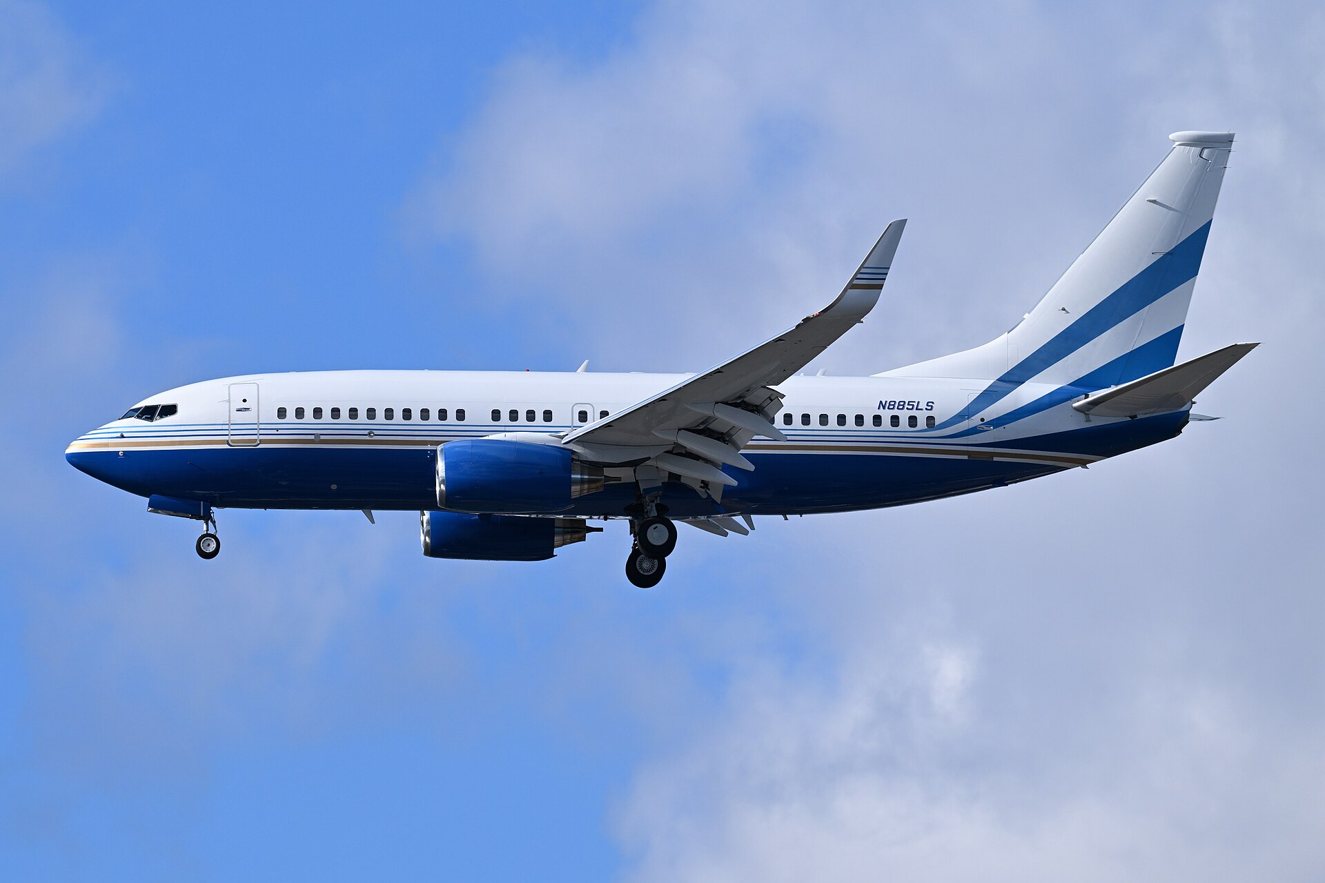 A Boeing 737-700 business jet on final approach to land