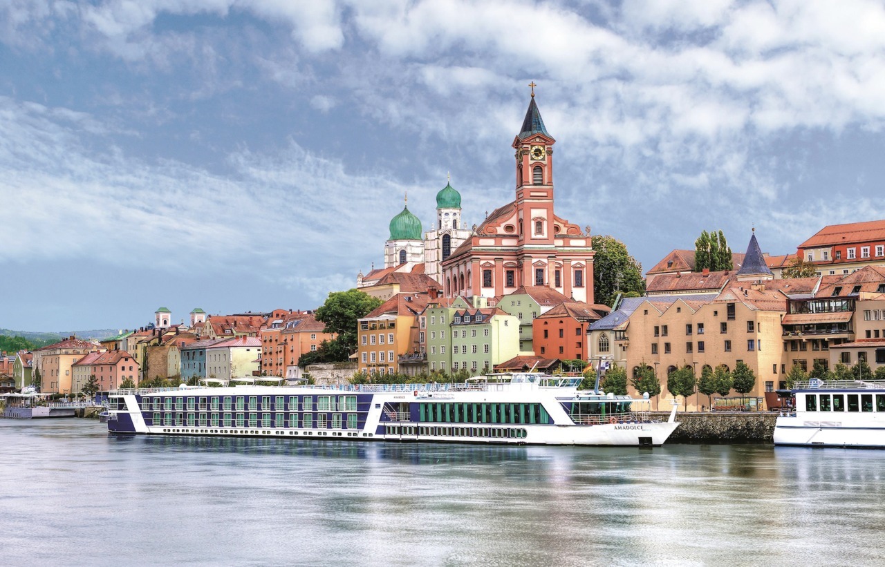 Passengers enjoying dinner on the sun deck of a river cruise ship
