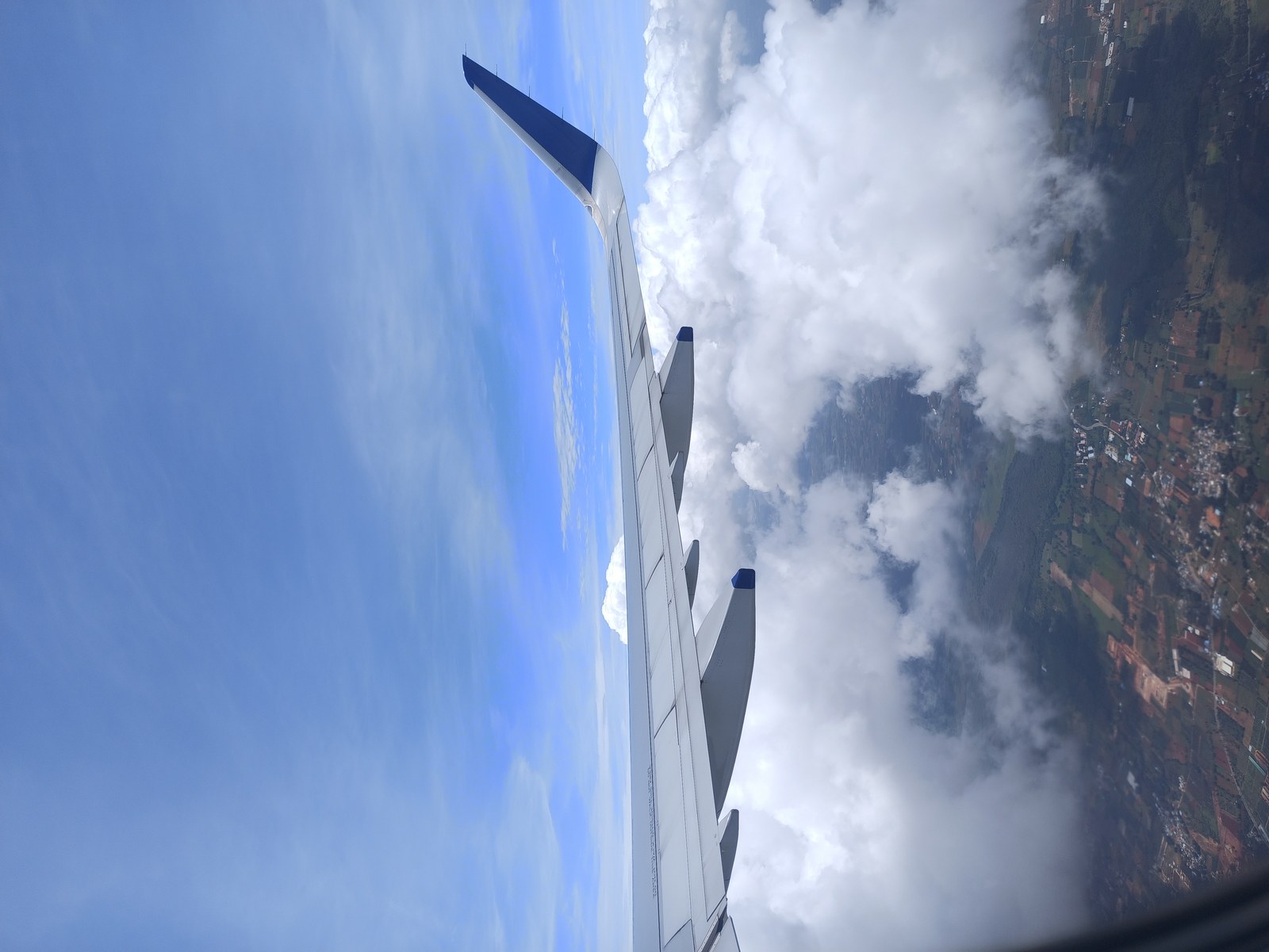 Airplane wing viewed from a passenger window during flight