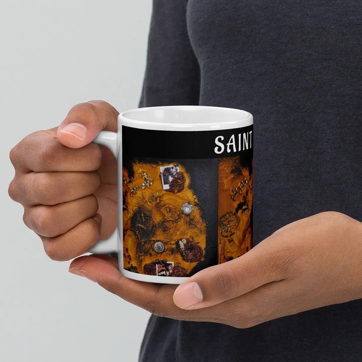 SAINT KYRIAKI art-inspired ceramic mug featuring original artwork by Katie Chonacas in rich orange and black tones