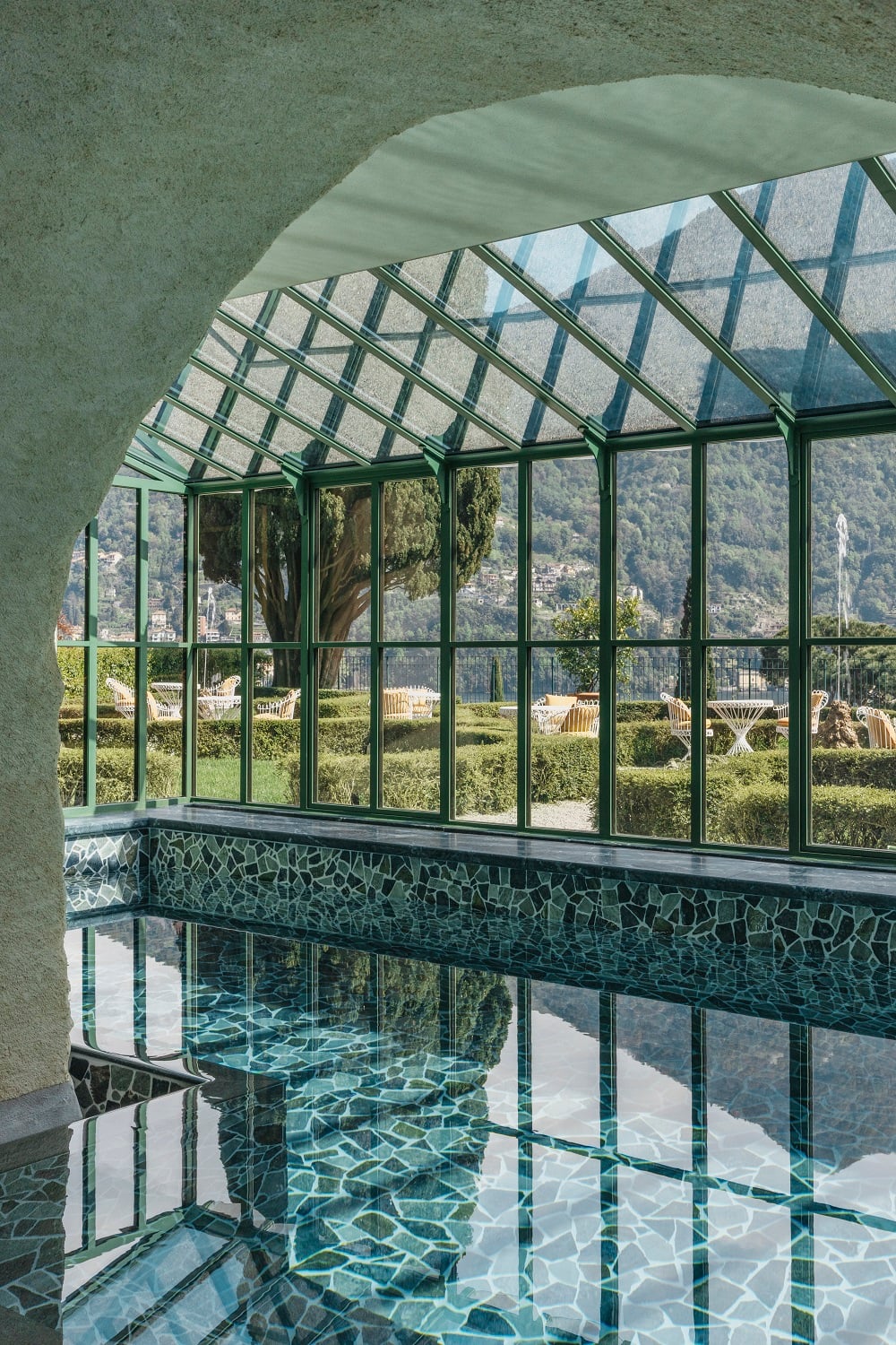 Heated indoor spa pool at Passalacqua opening onto the gardens at Moltrasio, Lake Como